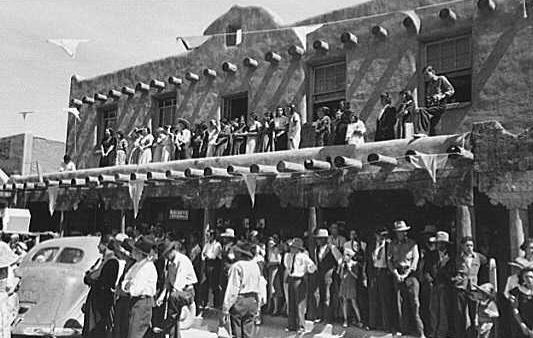Southwestern building packed with people on both of its two floors