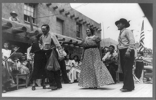Two men and a woman dancing in the streets 1940